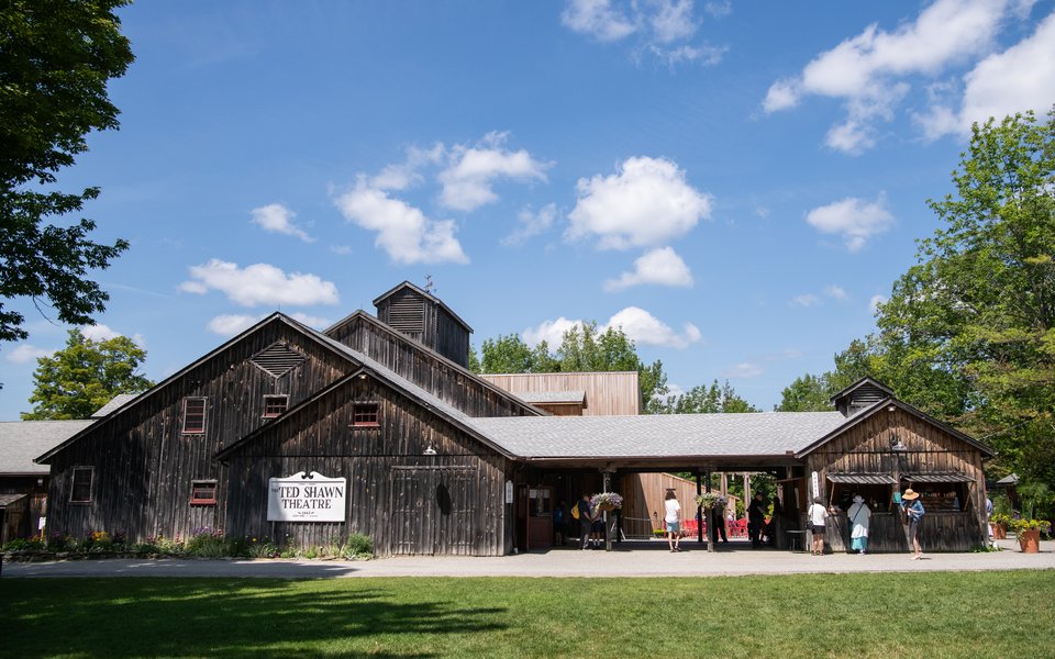 An image of the outside of the Ted Shawn Theatre on a sunny day.